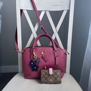Coach satchel with detachable crossbody strap, wallet, and keychain.